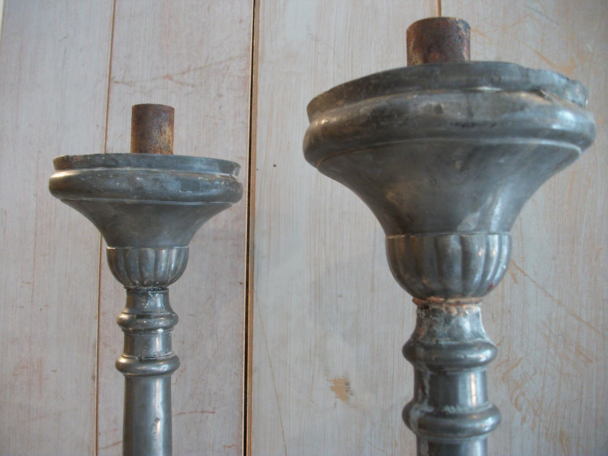 a pair of pewter candlesticks